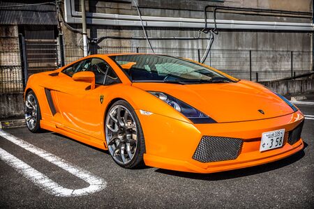 NIKKO, JAPAN - NOVEMBER 13, 2016: Orange Lamborghini Gallardo on the street of Nikko town, Japan. Nikko is a popular destination for Japanese and international tourists with Tosho-gu temple.のeditorial素材