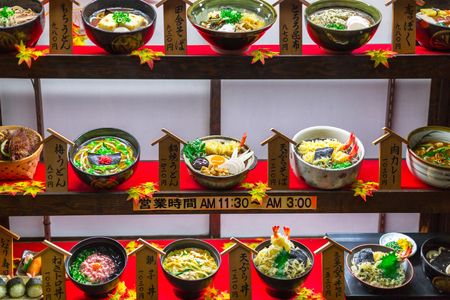 KYOTO, JAPAN - NOVEMBER 10, 2016: Restaurant window with plastic fake food in Kyoto, Japan. Fake food is a model or replica of a food item made from plastic, wax, resin or similar material.のeditorial素材