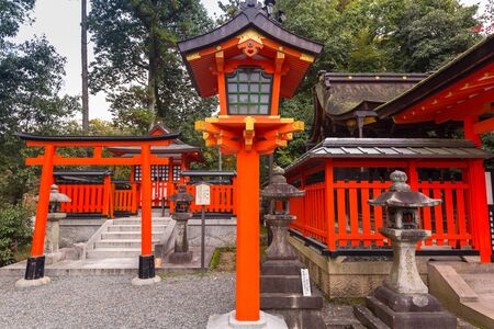 KYOTO, JAPAN - NOVEMBER 10, 2016 : Buddhist temple at Fushimi Inari Shrine with thousands of torii gates in Kyoto, Japan. Torii is a traditional Japanese gate commonly found in a shrine.のeditorial素材