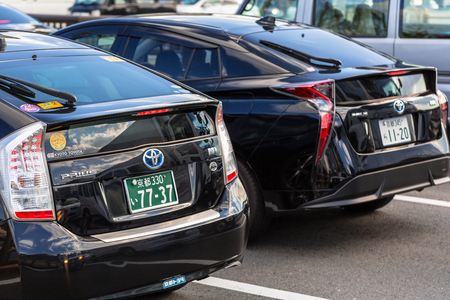 KYOTO, JAPAN - NOVEMBER 11, 2016: Toyota prius on the street of Kyoto in Japan. The Toyota Prius is very popular full hybrid electric automobile manufactured in Japan.のeditorial素材