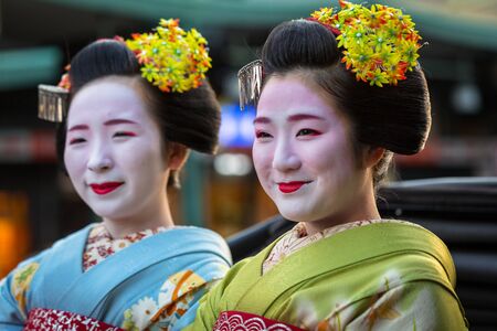 KYOTO, JAPAN - NOVEMBER 11, 2016: Maiko women, apprentice geisha on the street parade in Kyoto, Japan. Kyoto was formerly the Imperial capital of Japan for more than one thousand yearsのeditorial素材