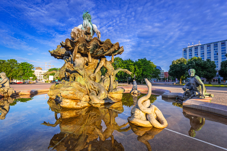 The Neptune Fountain in Berlin at sunrise, Germanyの写真素材