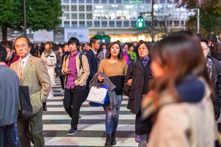 TOKYO, JAPAN - NOVEMBER 12, 2016: Shibuya scramble crossing in Tokyo at night, Japan. Shibuya Crossing is one of the busiest crosswalks in the world.のeditorial素材
