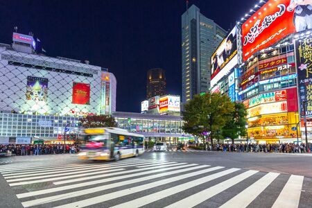 TOKYO, JAPAN - NOVEMBER 12, 2016: Shibuya scramble crossing in Tokyo at night, Japan. Shibuya Crossing is one of the busiest crosswalks in the world.のeditorial素材
