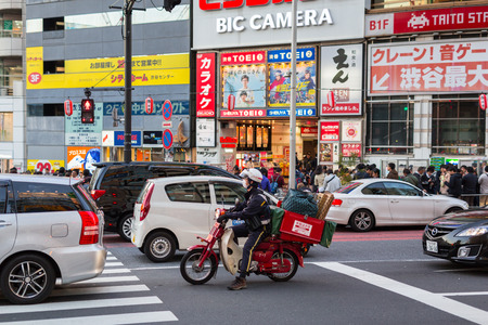 TOKYO, JAPAN - NOVEMBER 12, 2016: Crosswalk at Ikebukuro district of Tokyo metropolis, Japan. Tokyo Metropolis is both the capital and most populous city of Japan.のeditorial素材