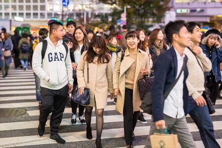 TOKYO, JAPAN - NOVEMBER 12, 2016: Shibuya scramble crossing in Tokyo at night, Japan. Shibuya Crossing is one of the busiest crosswalks in the world.のeditorial素材