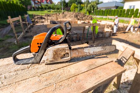 Cutting clapboards for concrete foundation of a houseの写真素材