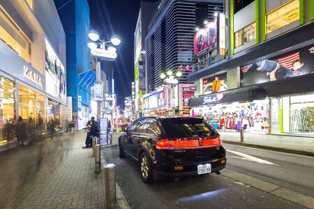 TOKYO, JAPAN - NOVEMBER 12, 2016: Busy streets of Shibuya district in Tokyo at night, Japan. Shibuya is the shopping district which surrounds Shibuya Station, one of Tokyo's busiest railway stations.のeditorial素材
