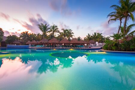 PLAYA DEL CARMEN, MEXICO - JULY 11, 2011: Luxury swimming pool scenery at RIU Yucatan Hotel in Playa del Carmen, Mexico. RIU Hotels & Resorts has more than 100 hotels in 19 countries.のeditorial素材