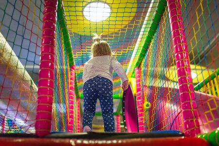 Little girl having fun at the playgroundの写真素材