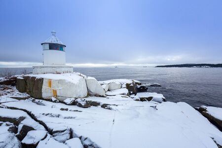 Lighhouse at Baltic sea coast in winter, Swedenの写真素材