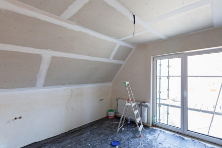 Empty bedroom interior with gypsum board ceiling at renovationの写真素材