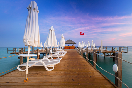 Beautiful scenery with wooden pier on Turkish Riviera at sunset, Sideの写真素材