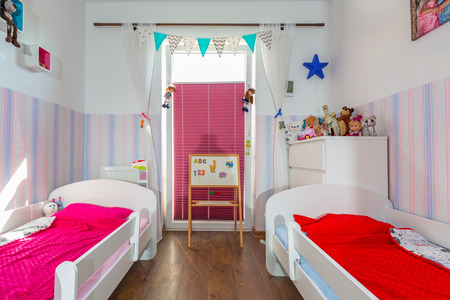 Kids bedroom interior with pastel color wallpapersの写真素材
