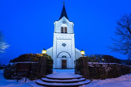 White church in small village of Sweden at nightの写真素材