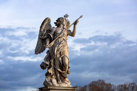 Angel statue on the Saint Angelo Bridge over Tiber river in Rome, Italyの写真素材