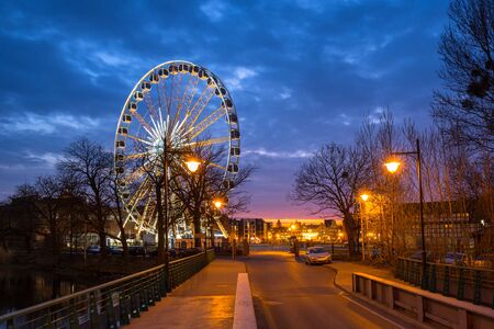 Sunset over the Gdansk city with illuminated ferris wheel, Polandの写真素材