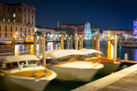 Canals of Venice city with beautiful architecture at night, Italyの写真素材