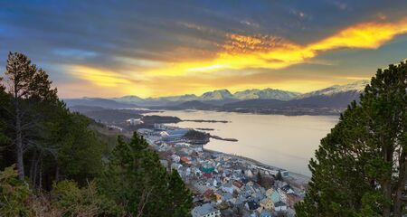 Scenery of Alesund city over Norwegian Sea with beautiful sunrise, Norwayの写真素材