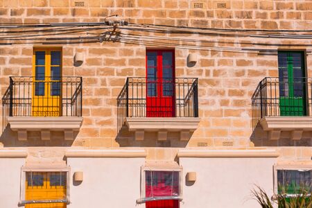 Colorful doors and windows of traditional Maltese housesの写真素材