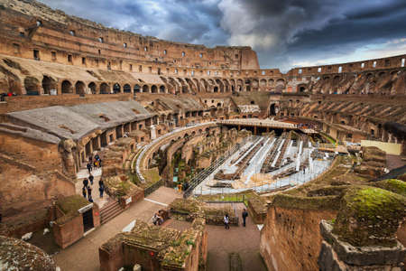 Rome, Italy - January 10, 2019:  The interior of the Colosseum in Rome with dark clouds, Italyのeditorial素材