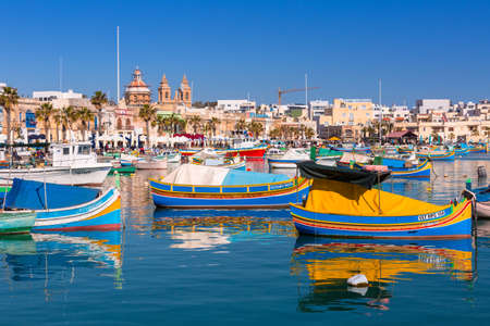 Sliema, Malta - January 10, 2020: Traditional fishing boats in the Mediterranean Village of Marsaxlokk, Maltaのeditorial素材