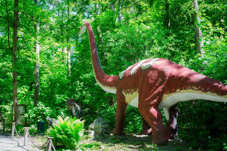 Malbork, Poland - June 1, 2020: Realistic dinosaur at the Dino Park in Malbork, Poland. Dino Park is a tourist attraction with moving dinosaurs and dragons.のeditorial素材