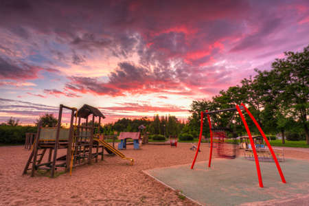 Beautiful sunset over children playground in Pruszcz Gdanski, Poland.の写真素材