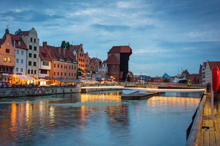 Gdansk, Poland - August 2, 2020: Amazing architecture of Gdansk old town at dusk with a new footbridge over the Motlawa River. Polandのeditorial素材