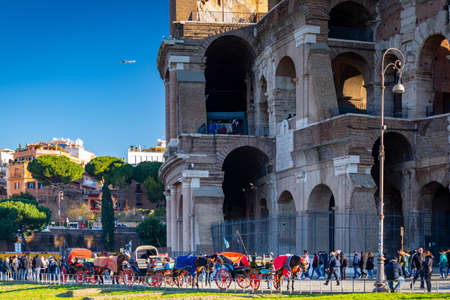 Rome, Italy - January 11, 2019: Horse carriages at the Colosseum in Rome at sunrise, Italyのeditorial素材