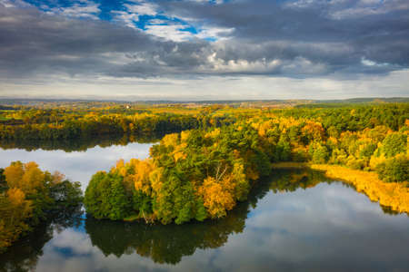 Golden autumn of Poland by the Straszyn lake from above.の写真素材