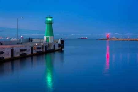 Lighthouse on the west breakwater in Nowy Port at dusk, GdaÅsk. Polandの写真素材