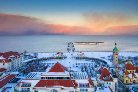 Beautiful sunset over the snowy beach and pier (Molo) in Sopot at winter. Polandの写真素材