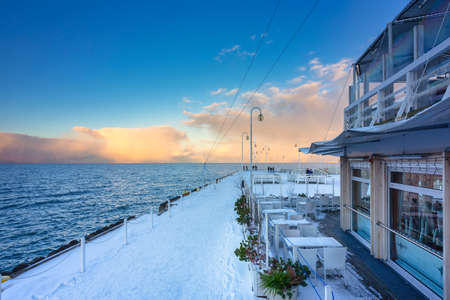 Beautiful sunset over the snowy pier (Molo) in Sopot at winter. Polandの写真素材