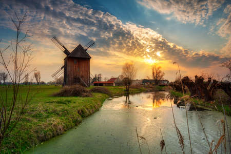 Sunset at an old windmill in the countryside, Polandの写真素材