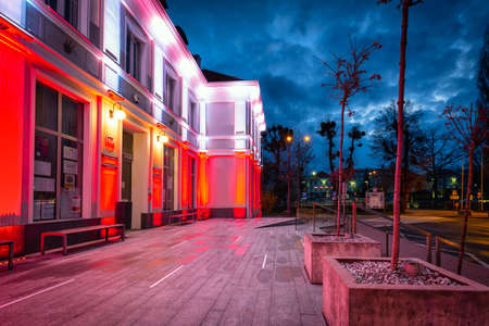 Pruszcz Gdanski, Poland - May 3, 2021: Red and white illumination at the Constitution Day on May 3 on the  City Hall building in Pruszcz GdaÅski. Polandのeditorial素材