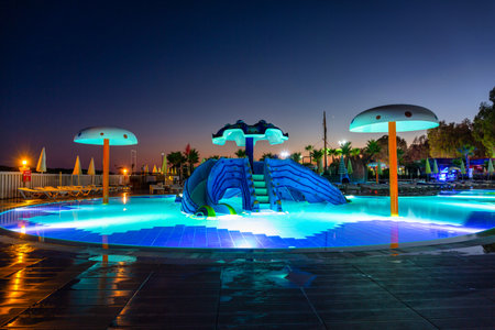 Turker, Turkey - July 19, 2021: Beautiful pool area of the Eftalia island in Alanya province at dusk, Turkey. The complex of several Eftalia hotels is located on the Turkish Riviera.のeditorial素材