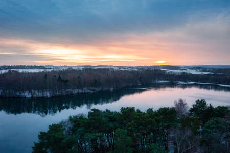 Aerial landscape of a wintery lake at sunset. Polandの写真素材