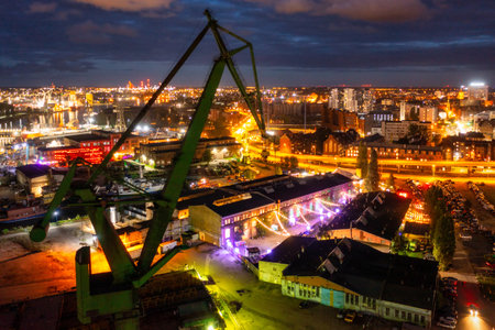 Gdansk, Poland - September 2, 2022: Gdansk shipyard scenery (Stocznia or 100cznia in polish means shipyard) with retro-lighted clubs and bars at dusk, Poland.の写真素材