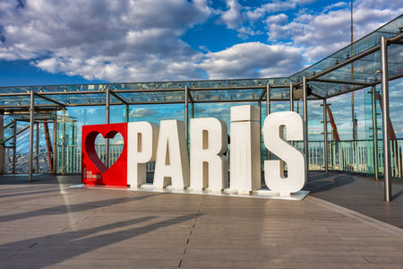 Paris, France - September 16, 2022: Love Paris sign on the Tour Montparnasse, a 210 meters tall skyscraper located in the Montparnasse area of Paris, France.のeditorial素材