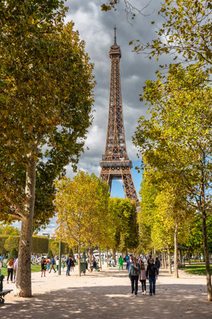 Paris, France - September 17, 2022: People under the Eiffel Tower in Paris at sunny day. Franceのeditorial素材
