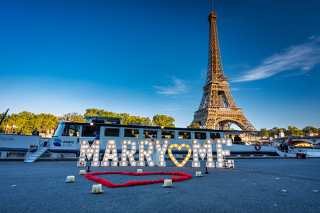Paris, France - September 17, 2022: The romantic scenery of a marriage proposal with the inscription marry me in front of the Eiffel Tower in Paris, Franceのeditorial素材