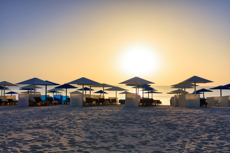 Sun loungers with umbrellas on the beach in Marsa Alam at sunrise, Egyptの写真素材