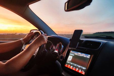 Driving a car at amazing sunset.の写真素材