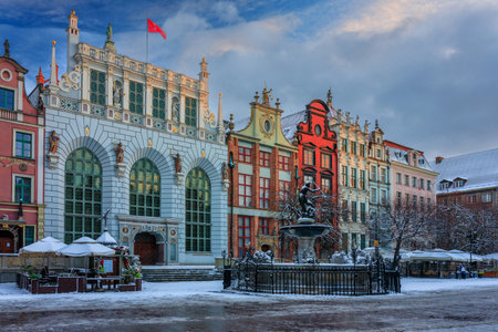 Sunrise in the historic center of Gdansk with the Neptune fountain at winter, Poland.の写真素材