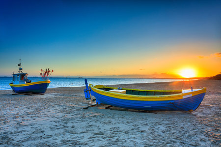 Fishing boats on the beach of Baltic Sea in Sopot at sunrise, Polandの写真素材