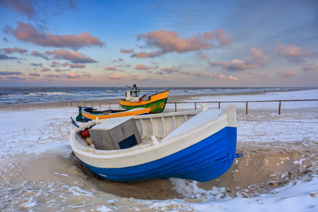 Fishing boats on the Baltic Sea beach in Jantar at winter. Polandの写真素材