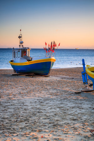 Fishing boats on the beach of Baltic Sea in Sopot at sunrise, Polandの写真素材