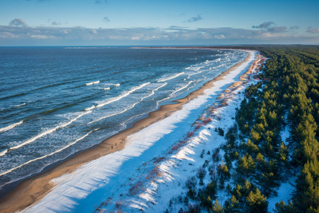 Beautiful scenery of Baltic Sea beach in Sobieszewo at snowy winter, Polandの写真素材