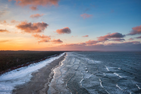 Winter sunset over the Baltic Sea in Jantar, Polandの写真素材